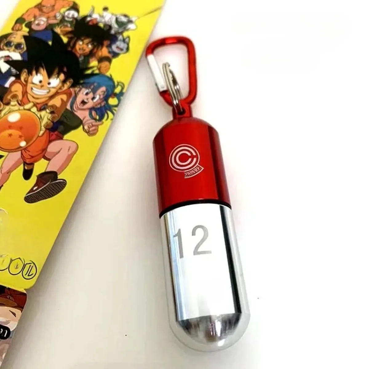 Llavero de Dragon Ball de metal, organizador de pastillas portátil – dragon ball a